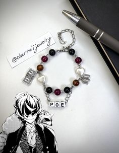 -Handmade Edgar Allan Poe inspired bracelet with dangling charms and name tag -Adjustable with semi-loose fit on smallest setting -Made with stainless steel, acrylic beads, and plastic charms -Take care when handling and do not tug on the bracelet, as it is handmade and delicate. May appear tangled occasionally but is easy to fix Adjustable Metal Name Bracelet With Charms, Bsd Bracelet, Bead Set, Alpha Werewolf, Cute Text Symbols, Bracelet Craft Diy, Anime Crafts, Edgar Allan Poe, Stray Dogs Anime