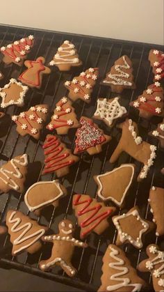 there are many decorated cookies on the grill