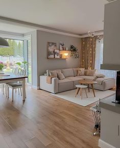 a living room filled with furniture and a fire place