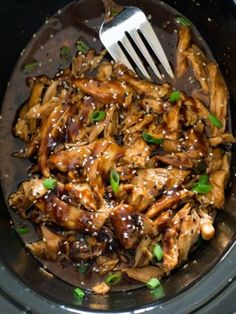 a close up of food in a bowl with a fork