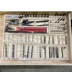 an assortment of tools are displayed in a box