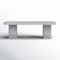 a concrete bench sitting on top of a white floor