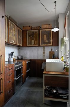 a kitchen with wooden cabinets and white sink