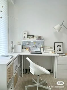 a white chair sitting in front of a desk