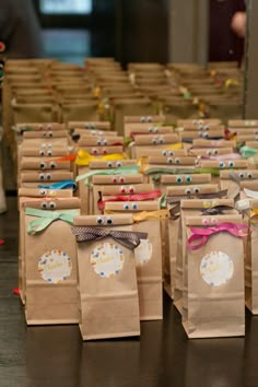 small brown paper bags with bows on them