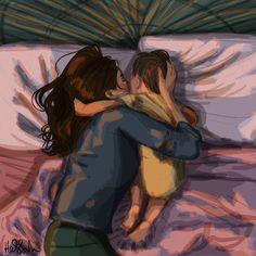 two people hugging each other on a bed