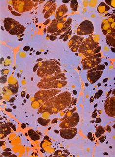 an abstract painting with yellow and brown spots on purple paper, which has orange dots in the center