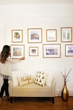 Lovely gallery wall of our gold bamboo Mandalay frame. | via @hauteofftherack Wedding Gallery Wall, Africa House, Office Revamp, Burgundy Living Room, Bamboo Picture Frames, Family Gallery Wall, Custom Picture Frames, Cambridge House