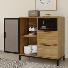 a wooden cabinet sitting on top of a rug