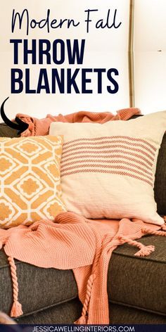 a couch with pillows and blankets on top of it, in front of a white sign that says modern fall throw blankets