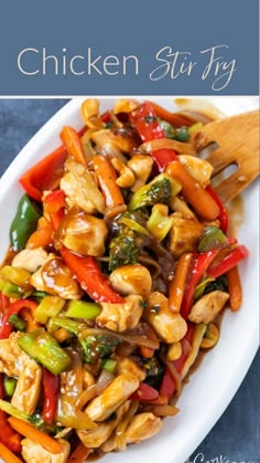 chicken stir fry with peppers and broccoli in a white dish on a blue background