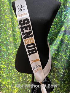 a black and white neck tie with the words geekpop on it's side