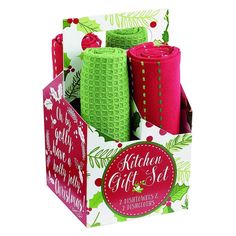 the kitchen gift set includes four cups and two napkins in a christmas themed box