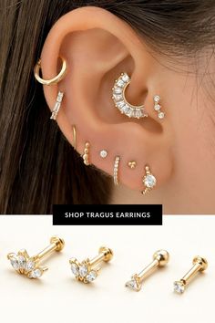 three pairs of ear piercings with crystal stones in the middle and two different designs on each