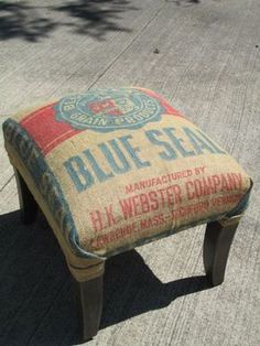 an old blue seal advertisement is sitting on the sidewalk