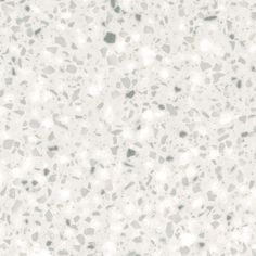 a white and gray speckled surface with small dots