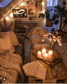 a living room filled with furniture and candles