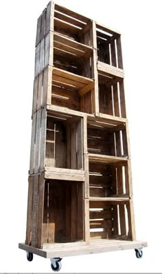 a stack of wooden crates sitting on top of a white floor next to each other