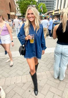 Denim dress with knee high black cowboy boots #denim #cowboy #boots Tan Cowboy Boots Outfit Summer, Denim Dress Festival Outfit, Casual Summer Bar Outfits, Calf Black Boots Outfit, October Country Concert Outfit, Black Cowboy Boots Outfit Going Out, 21st Birthday Outfits Cowboy Boots, Brunch Nashville Outfit, Work Outfit Cowboy Boots