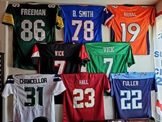 football jerseys are hung up on the wall