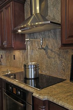 a stove top oven sitting inside of a kitchen