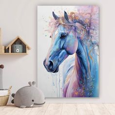 a painting of a blue horse on a white wall next to a stuffed animal toy