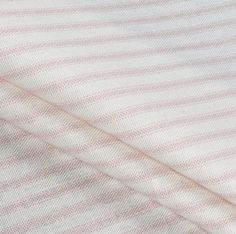 pink and white striped fabric, close up