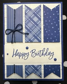 a happy birthday card with blue and white plaid designs on it's front side