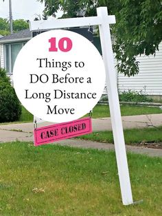 a sign that says 10 things to do before a long distance move in front of a house