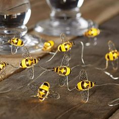 Decorate your home or any event that you may have with this Mainstays 18 LED Bumble Bee Wire String Lights. The unique design will surely delight everyone around. It is perfect for weddings, or floral arrangements. This light set is equipped with Battery Operated Automatic Timer, so that you can set it up to light and it can turn on again at the same time the next day. The string lights has 6Ft lighted length and 7Ft total length. The lead cable from the battery box to the first LED is 12 inches Bumble Bee Backdrop, Bumble Bee Christmas Tree, Beeday Party Decor, Bumble Wedding, Bee Inspired Decor, Bumble Bee Baby Shower Ideas, Bee Birthday Party Decorations, Bee Baby Shower Centerpieces, Bee Lights