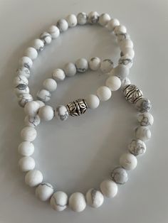 White Howlite 8mm beaded bracelets. Cheap White Beaded Bracelets For Everyday, Cheap White Beaded Bracelets With Round Beads, Elegant Bracelets With Natural Round Beads, Elegant Rosary Bracelet With Natural Stones, White Stretch Bracelet With Faceted Beads For Healing, White Faceted Beads Round Jewelry, Elegant White Crystal Bracelet With Spacer Beads, White Gemstone Beads Bracelet As Gift, Howlite Round Beads Jewelry Gift