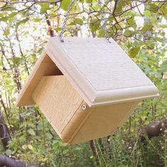 a bird house hanging from a tree branch