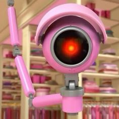 there is a pink toy with a red light in it's eyes and arms