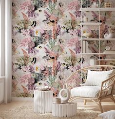 a living room with floral wallpaper and white furniture