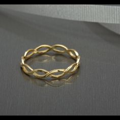 a gold ring sitting on top of a table