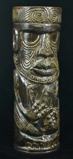 a silver vase with an intricate design on it