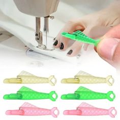 the sewing machine is being used to sew on nails