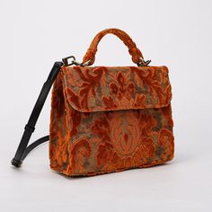 With a nod to the Victorian era, MCW's freshly combines the classic and elegant design of the traditional carpet satchel with a textural and tactile twist. This exquisite top handle satchel is a perfect blend of style and practicality. Spacious interior with zipper and slip pockets, detachable shoulder strap. Sturdy exterior in carpet or velvet, cotton lining. Convenient magnetic flap closure, brass feet for stability. Features: * Detachable, adjustable shoulder strap * Magnetic flap for easy ac Traditional Carpet, Quoi Porter, Burnout Velvet, Iphone Pro, Baby Bag, Victorian Era, Lambskin Leather, Leather Top, Hand Bag