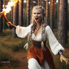 a woman dressed in medieval clothing holding a stick with fire coming out of her mouth