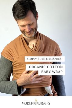 A father using The Simply Pure Organic Cotton Baby Wrap to hold their baby up. Baby Wrap Carrier