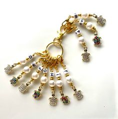 a keychain with beads and charms attached to it