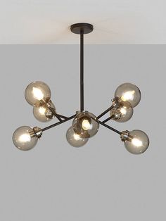 a chandelier with eight lights hanging from it's center and five bulbs on each end