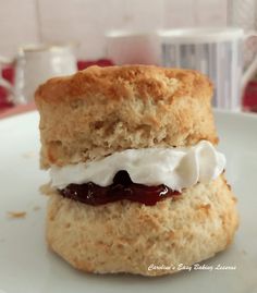 a scone with cream and jelly on it