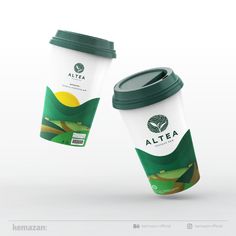 two coffee cups with green lids are shown next to each other on a white background