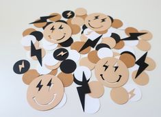 a pile of mickey mouse stickers with faces and lightning bolts on them, all in different shapes and sizes