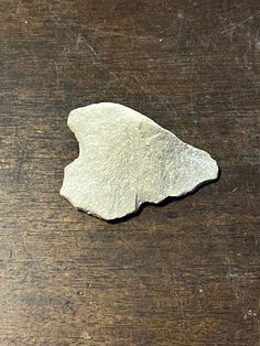 a piece of rock sitting on top of a wooden table