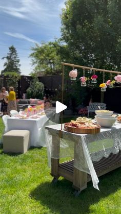 a table with food on it in the grass