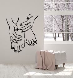 a black and white photo of a wall with a drawing of two hands holding each other