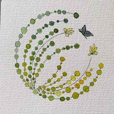 a painting with green and yellow circles on white paper next to a bird flying in the sky