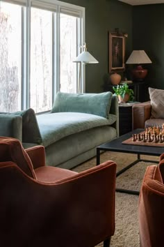 a living room filled with furniture and a chess board